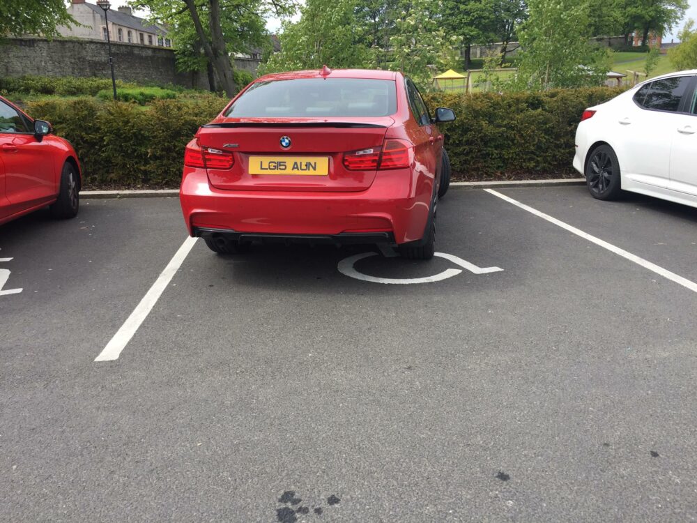 BMW in a Blue Badge (Handicap) Parking Spot - DERRY Parking Facebook